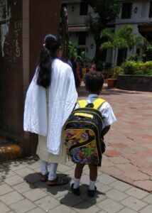Ayush and Shyama entering the school